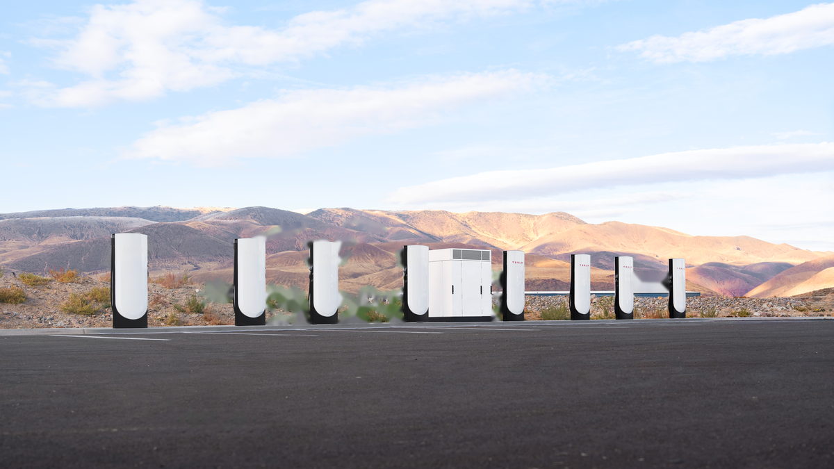 A row of high-speed ParadigmEV chargers at sunset