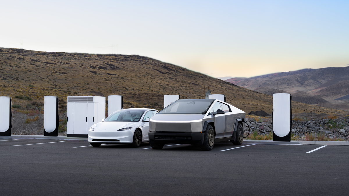 Vehicles charging at a ParadigmEV site at dusk